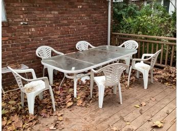 Aluminum Outdoor Table With Glass Top And 6 Plastic Chairs