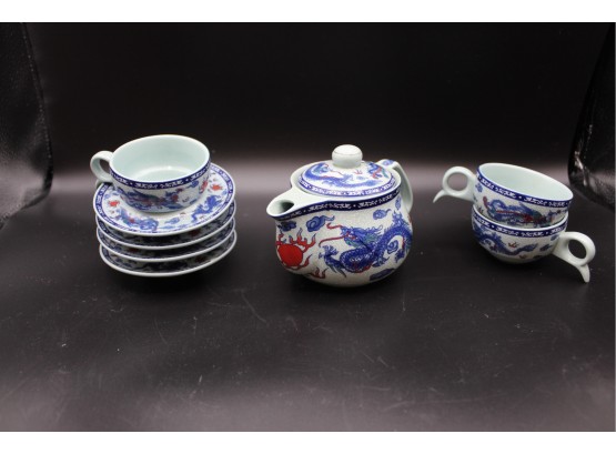 Three Tea Cups, Four Saucers, And Teapot With Blue Dragon Pattern (106)