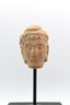 15th Century Fragment Of A Stone Buddha Head On Wooden Base