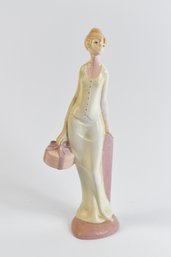 Woman Holding Gift Figurine