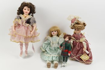 4 Porcelain Dolls Of Different Sizes