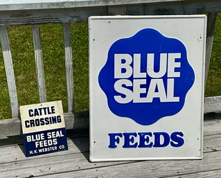 Two Metal Blue Seal Advertising Signs