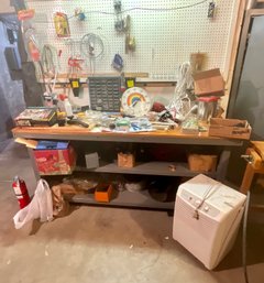 Work Table And Contents & Dehumidifier In Basement