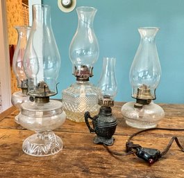 Four Antique Oil Lamps, One Electrified