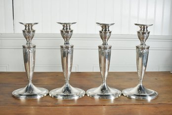 Four Antique Weighted Sterling Candlesticks (CTF10)