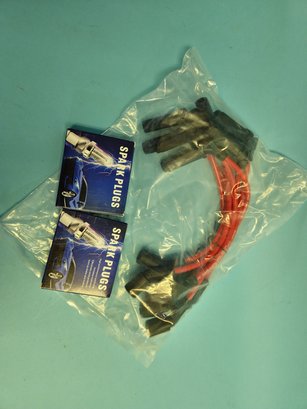 Lot Of Two Brand New In Box 4-packs Of Spark Plugs And Brand New In Bag Cables