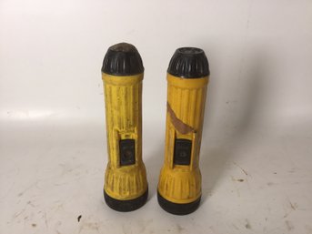 Two Yellow And Black 8 Inch Brightstar Flashlights