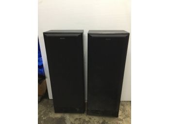 Two Large Standing Sony Speakers In Simulated Wood Cabinet