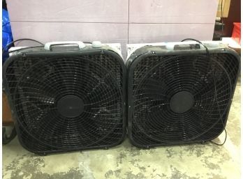 Two Square Black Lasko Fans With Separate Filters Attached On Back