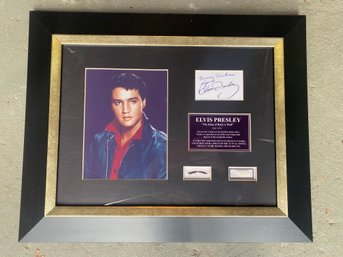 AUTHENTIC STRANDS OF ELVIS PRESLEY'S HAIR, TOGETHER WITH A PIECE OF THE ACTUAL TOWEL HE WORE DURING HAIRCUTS