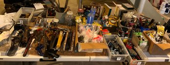 Large Table Filled With Tools & Accessories