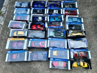 Very Large Lot (about 100) NIB Maisto Model Cars. (16 Filled Cardboard Boxes)