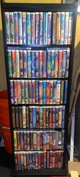 About 95 Disney VHS Tapes. Many Sealed. With Shelf