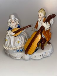 Vintage Porcelain  Duo Playing Instruments.