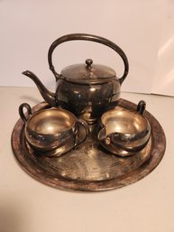 Four Piece Silver Over Copper Tea Set