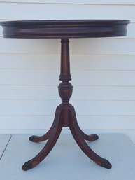 Round Mahogany Drum Table Terminating In Metal Paw Feet