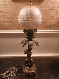 Figural Cherub Table  Lamp With Ornately Decorated Gold Ball Shade