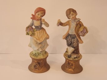 Pair Of Bisque Figurines.