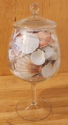 Glass Pedestal Jar Filled With Sea Shells