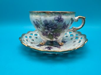 Gilded Pierced Rim Violets Iridized Teacup And Saucer