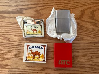 2 Cigarette Lighters - Camel & ATC