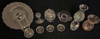 An Assortment Of Clear Glass Dishes Including Tray, Lidded Etched Dish, Vases And More