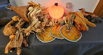 An Assortment Of Fall Decor With Gourds, Corn, Wreath, Turkey Shaped Candles And More