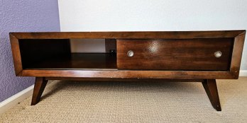 MCM Dark Wooden Coffee Table With Sliding Doors That Open And Close On Opposite Side