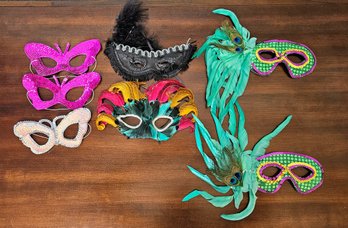 An Assortment Of Masquerade Masks With Sequence And Feathers