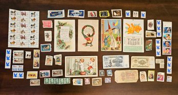 Vintage Stamps And Foreign Money With An Antique Calendar And Postcards