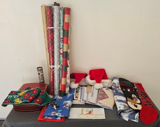 A Collection Of Wrapping Paper, Christmas Cards, Assorted Table Cloths And More