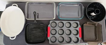 An Assortment Of Kitchen Bakeware Incl. Cast Iron, Enamel, Glass Cake Pans And More