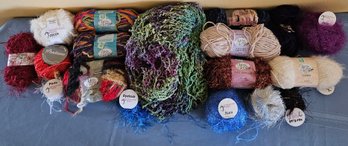 An Assortment Of Yarn With Various Blends, And Colors