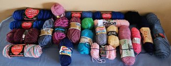 An Assortment Of Multi Colored Yarn With Brands Bernot, Red Heart, Patons And More
