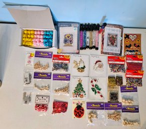 A Collection Of Art Supplies Incl. Wooden Beads, Miniature Tinsel, Motifs, Beads And More