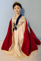 Porcelain Doll In Red & White Dress With Blue Sash & Doll Stand