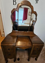Antique  4 Drawer Mirrored Vanity On Casters With Victorian Brass Hardware