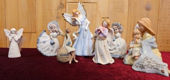 A Collection Of Ceramic, Porcelain And Resin Angels