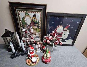 An Assortment Of Christmas Decor Incl Holiday Prints Christmas Tree Candles And More
