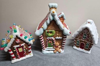 An Assortment Of Christmas  Ceramic Gingerbread Houses Incl Cookie Jars And More