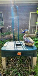 Green Yard Ornament With A Step 2 Bench And Ceramic Duck From Mexico