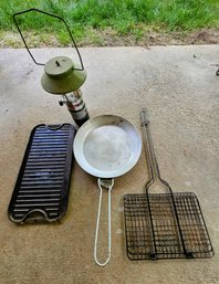 An Assortment Of Camping Supplies Incl. Propane Lantern,  Cast-iron Griddle And More