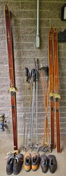 An Assortment Of Vintage Ski's, Ski Shoes And Poles