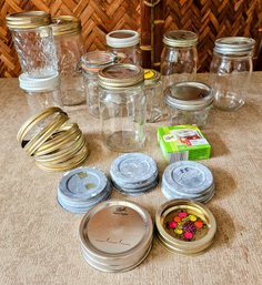 An Assortment Of Vintage Jars With Lids