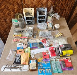 Hardware Lot Including  New Picture Hangers, New And Used Nails, Screws, Hooks, And More