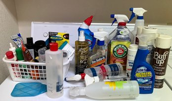 An Assortment Of Cleaning Supplies And Empty Spray Bottles