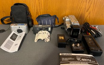 Misc. Cameras Including Olympus Camera, Hp Camera, And Sharp Camcorder With Extra Batteries