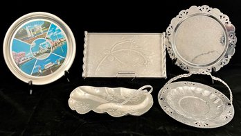 A Collection Of Aluminum Dishes