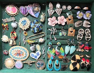 A Collection Of Vintage Pins And Clip-on Earrings