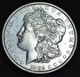 1889  Morgan Silver Dollar  AU Full Chest Feathering  (ytc25)